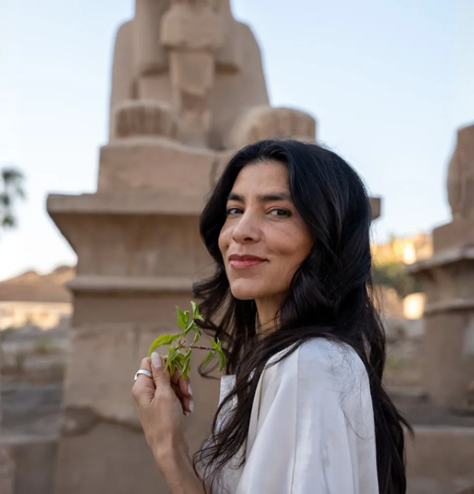 Deborah beside the temple statue