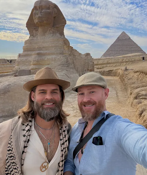 Brandon with a friend in front of the Sphinx and a pyramid