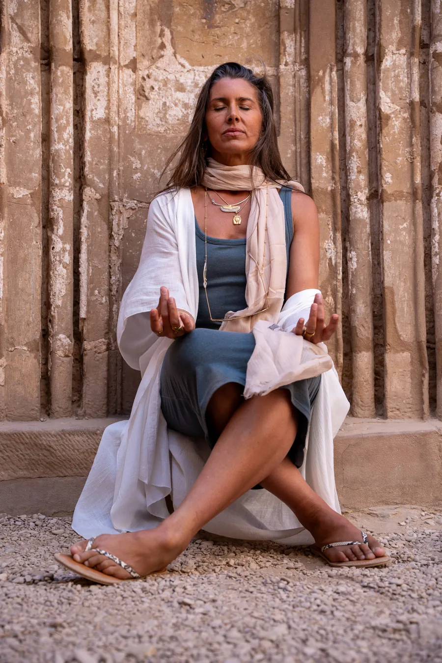 Deborah Yager meditating at the Seven Gates wall in the Karnak Complex in Luxor, Egypt